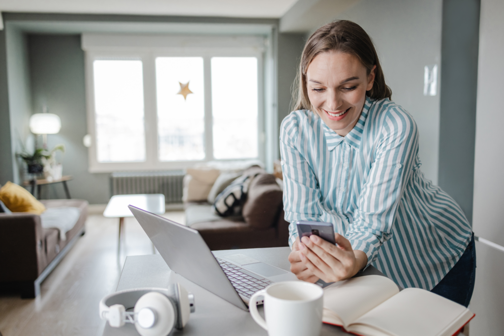 Woman on laptop and computer learning to Invest in the stock market